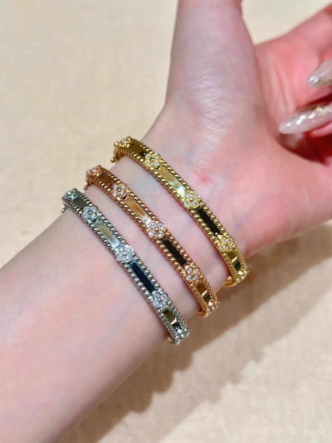 Van Cleef & Arpels Elegant Gold and Silver Bracelets Set